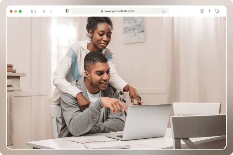 Two people building a website together on a laptop with CloudWebHost